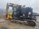 2017 Caterpillar 325FL crawler excavator with drilling attachment, side view