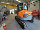 2015 Develon DX85R-7 mini excavator, rear three-quarter view