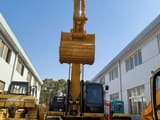 Caterpillar 336D crawler excavator, front view with boom raised