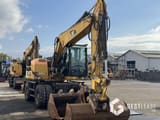 2014 Caterpillar M313D wheel excavator, front three-quarter view