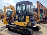Komatsu PC55MR-2 mini excavator, front three-quarter view
