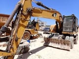 2016 Caterpillar M320F wheel excavator, front three-quarter view