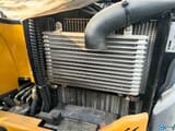 2022 XCMG XE17U Crawler Excavator showing the engine compartment with visible radiators and hoses.