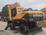 2024 Hyundai R210W-9T wheel excavator, rear three-quarter view