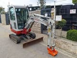 2012 Takeuchi TB219 mini excavator, front three-quarter view