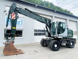 2009 New Holland MH-PLUS wheel excavator, side profile view