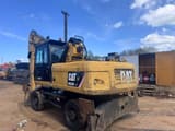 2011 Caterpillar M322D MH material handler, rear three-quarter view