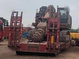2016 Caterpillar 6015FS crawler excavator on a flatbed trailer