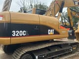 2022 Caterpillar 320CL crawler excavator, side profile view
