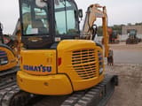 2024 Komatsu PC55MR-5 mini excavator, rear three-quarter view