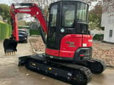 2024 Yanmar VIO55-6B mini excavator, rear three-quarter view
