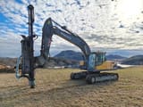 2007 Volvo EC210CL crawler excavator with drilling attachment, side view