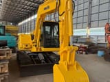 2018 Komatsu PC60-7 mini excavator, front three-quarter view