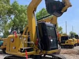 2024 Caterpillar 307E mini excavator, rear three-quarter view