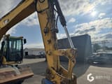 2008 Caterpillar M313D wheel excavator boom and cab view