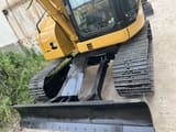 2021 Caterpillar 308C mini excavator front view with blade