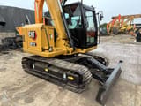 2024 Caterpillar 307E2 mini excavator, front three-quarter view