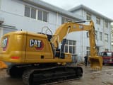Caterpillar 320GC crawler excavator, rear three-quarter view