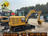 2023 Caterpillar 305.5E2 mini excavator, rear three-quarter view