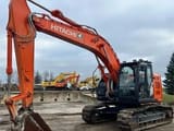 Hitachi ZX225 crawler excavator, side profile view