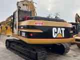 2023 Caterpillar 320BL crawler excavator, rear three-quarter view
