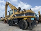 2005 Caterpillar M325C material handler, rear three-quarter view