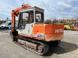 1990 Hitachi EX60 crawler excavator, rear three-quarter view