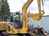 2024 Komatsu PC-55MR mini excavator, front three-quarter view