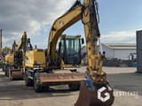 2008 Caterpillar M313D wheel excavator, front three-quarter view