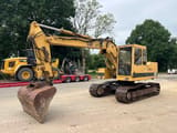 Caterpillar 211BLC crawler excavator, front three-quarter view