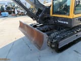 2010 Volvo ECR88 PLUS mini excavator front view with blade