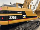 2023 Caterpillar 320BL crawler excavator, rear three-quarter view