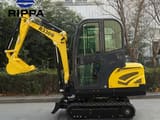 2026 Rippa R330 Mini Excavator from the side, highlighting the black rubber tracks and the yellow main body.
