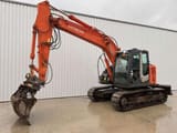 2010 Hitachi ZX135US-3 crawler excavator, side view