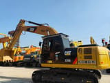 2023 Caterpillar 320D2 L crawler excavator, rear three-quarter view