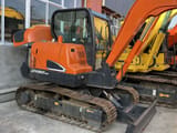 Doosan DX60-9C mini excavator, side view