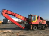 2000 O&K MH 6.5 wheel excavator, side profile view