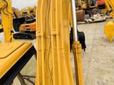 2015 Caterpillar 320B crawler excavator boom and hydraulic detail