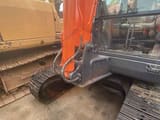 2018 Doosan DX60 crawler excavator, side view of cab and boom base