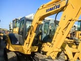 Komatsu PC55MR-5 mini excavator, side view