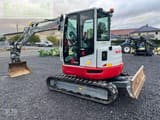 2023 Takeuchi TB257FR V1 mini excavator, rear three-quarter view