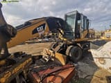 2008 Caterpillar M318D material handler, side view