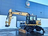 2012 Caterpillar M313D wheel excavator, side profile view