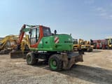 2006 New Holland MH-PLUS wheel excavator, rear three-quarter view