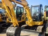 Komatsu PC55MR-5 mini excavator, front three-quarter view