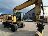 2016 Caterpillar M318F wheel excavator, front three-quarter view