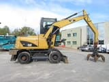 2009 Caterpillar M313D material handler, side view