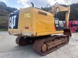 2016 Caterpillar 320E crawler excavator, rear three-quarter view