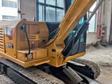 Caterpillar 307E2 mini excavator, side view