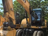 2019 Caterpillar M315D wheel excavator, front three-quarter view